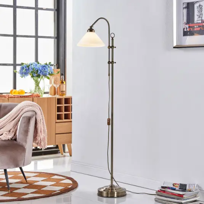 Otis floor lamp in antique brass